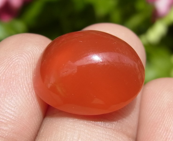 แก้ววิทรูย์สุริยะประภาสีส้มแดง 12.90 กะรัต