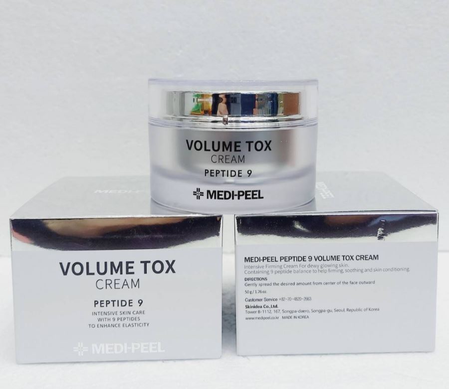 MEDI-PEEL Peptide 9 Volume Tox Cream 50 g. ครีมบำรุงผิว ครีมเรืองแสงวอเตอร์โกลว์ ปริมาณมอยซ์และยืดหยุ่นที่เติมเต็มความยืดหยุ่นของผิว ช่วยให้ผิวดูอ่อนเยาว์ โดยการสังเคราะห์และจับคอลลาเจนและอีลาสตินที่หลุดออกจากผิว มีส่วนผสมของเปปไทด์ 9 ชนิดช่วยเพิ่มปริมาณใ