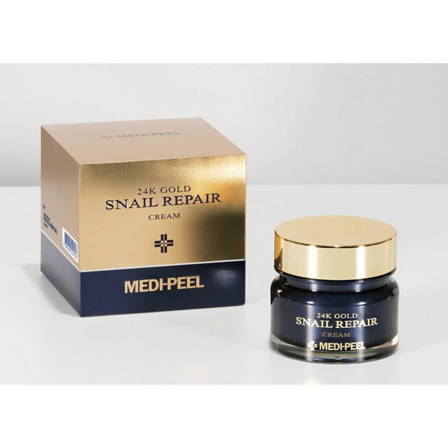 MEDI-PEEL 24K Gold Snail Repair Cream 50 g. ครีมหอยทากผสมทองคำ 24K ให้ความยืดหยุ่นแก่ผิวที่เหนื่อยล้าและยืดและปรับความสมดุลของผิวเพื่อให้มีความสมดุลและมีสุขภาพที่ดี น้ำมันสมุนไพรธรรมชาติเจ็ดชนิดเคลือบผิวด้วยความชุ่มชื้นมอบความชุ่มชื้นและความกระจ่างใส