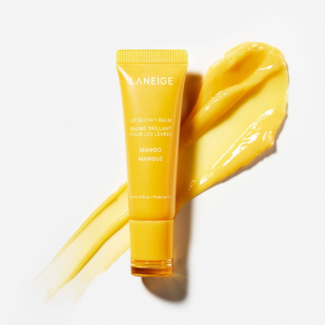 Laneige Lip Glowy Balm 10g. #Mango กลิ่นมะม่วง ลิปบาล์มเนื้อบางเบาและอุดมไปด้วยความชุ่มชื้น พร้อมด้วยเชียและบัตเตอร์เมล็ดมูรูมูรู เพื่อริมฝีปากที่นุ่ม ชุ่มชื้น และน่าจูบเป็นพิเศษตลอดทั้งวัน