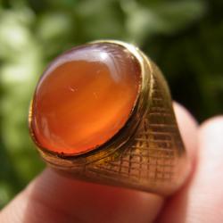 แหวนทองเหลืองหญิง เบอร์ 56 แก้วโป่งข่ามชนิดแก้ววิทรูย์สุริยะประภาสีส้ม